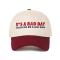 Close-up of retro embroidery text on two-tone cream and red cotton baseball cap - Burgundy