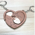 Creative wooden otter couple keychain set forming a heart shape on a wood surface - Heart Otter