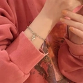Elegant silver chain bracelet featuring a delicate rose flower pendant for women - Rose