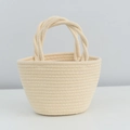 Handwoven cream cotton rope bucket bag with round dual handles and sturdy flat base - Beige Twist Handle
