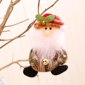 Plush Santa Claus ornament with red and green plaid hat and bell on a Christmas tree - Santa Claus