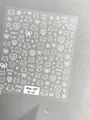 White minimalist cartoon bow and cat nail art stickers featuring AHA 087 style - Aha-8702 White Outline