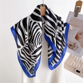 Stylish square zebra print silk scarf with blue border hanging on a wooden hanger - 70x70cm / Blue Edge Zebra (FJ966-3)