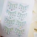 Detail of iridescent AB rhinestone face jewels with teardrop fringe on clear backing - BJA-501 (AB Color Tassel)