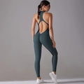 Detail view of open back yoga bodysuit with high-stretch fabric and ruched butt lifting design - S / Deep Teal
