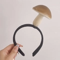 Black fabric headband featuring realistic brown mushroom ornament for girls - Mushroom