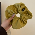 Olive green corduroy scrunchie with Oulifang label shown in hand for texture detail - Yellow Velvet Scrunchie