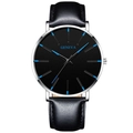 Detail of Geneva minimalist watch with black dial and blue pointers on silver case - Leather Strap Silver Case Blue Hands