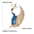 Detail view of enamel dancing girl brooch with dimensions 6.8cm height and 3.6cm width - Blue