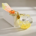 Kreativer Katzenpfoten-Schlüsselanhänger mit orangefarbenem Band und goldenem Glöckchen - Treibsand Leuchtender Stil / Zitronengelb