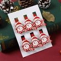 Détail de 6 pinces de Noël en bois avec bonhommes de neige rouges et blancs sur carte - Bonhomme de neige / Lot de 6