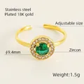 Adjustable 18K gold plated stainless steel ring featuring a round green zircon stone - Gold with Green Zirconia
