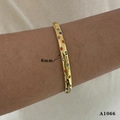 Detail view of a 6mm wide gold plated cuff bracelet with colorful star shaped stones - Gold Star Bracelet (A1066)