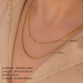 Detail of layered golden stainless steel necklaces with rope chain and beaded chain design - Rope And Satellite Chain Layered (CDNN084)
