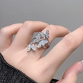 Silver butterfly open ring with sparkling zircon stones worn on a model's hand - Adjustable Open / Minimalist Butterfly-Hollow Zircon (JZ3756)