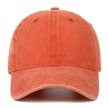 Front view of washed cotton baseball cap in brick red showing vintage texture and stitching - Orange