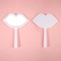 Pink lip-shaped handheld makeup mirrors showing front and back views on pink background - 12*16 White