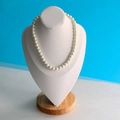 Classic white pearl necklace displayed on a white bust mannequin with a solid wood base - Large White PU