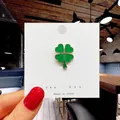 Cute green four-leaf clover metal brooch with golden trim on a white display card - 30*Green Four Leaf Clover Pin