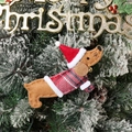 Detailed view of felt dachshund dog Christmas tree ornament with Santa hat and sweater - Dachshund in Sweater / Brown