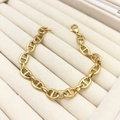 Detailed view of golden stainless steel pig nose anchor link bracelet with lobster clasp - Classic Anchor Link / Gold