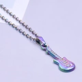 Close-up of a rainbow-plated guitar pendant on a metal chain against a purple background - Necklace / Colorful