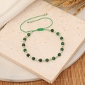 Handmade woven bracelet with green malachite-texture beads and adjustable cord - Peacock Green
