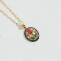 Vintage gold oval pendant necklace with black base, red gem flower and green leaves - Black Red