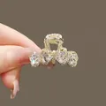 Cute golden hair claw clip with four heart-shaped crystals in a bow-tie design - Gold Heart Style