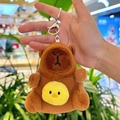Brown plush Capybara keychain with yellow chick decoration and silver metal lobster clasp - Holding Chick Dark Brown + Silver Clip