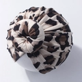 Detailed view of baby donut knot turban with classic brown leopard print pattern - Style E (Light Leopard)