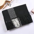 Detail shot of soft black and white plaid scarf featuring thick textured fringe tassels - Black and White Large Check