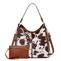 Detail of cow-print tote bag set with matching small pouch and brown leather straps - Two-Piece Set / Cow Print Brown
