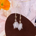 Close-up of white petal drop earrings with gold metal and sparkling square stones - Matte Petal Style (E3129/Silver Needle)