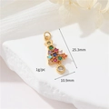 Macro shot of 14k gold Christmas tree pendant with colorful zircons and precise dimensions - Colorful Christmas Tree