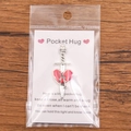 Gothic pocket hug metal red heart sword pendant on a descriptive gift card - Skull Heart with Sword