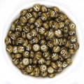 Golden acrylic round letter beads for DIY bracelets displayed in a white bowl - Imitation Gold + White Text