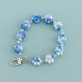 Blue and white gradient cat paw bead keychain with silver hook on a light blue background - Blue and White Gradient Paw Style (B345-1)