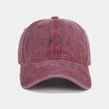 Detail of vintage washed cotton baseball cap featuring LOVE hand gesture graphics - Adjustable / Burgundy
