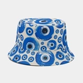 Detail of white bucket hat with blue evil eye patterns and reinforced brim stitching - One Size / Beige