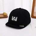Detail of black corduroy baby cap featuring letter C patch and textured fabric weave - 48-50cm (8 Months - 2 Years Old) / Letter C-Black