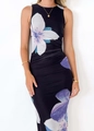 Detail view of a slim fit sleeveless black dress with purple and white floral print - Deep purple