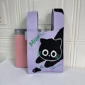 Purple knit tote bag featuring a cute cartoon cat pattern and white Miao lettering - Black Cat With Purple