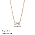 Minimalist gold bow necklace featuring a clear heart-shaped zircon pendant and thin chain - Necklace / Gold