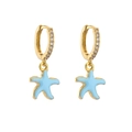 Detailed close-up of golden starfish earrings with blue enamel and micro-pave zircons - Sky Blue Starfish