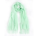 Soft pale green faux cashmere scarf with fringe details on a clean white fur background - Light Green