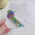 Close-up of cat-shaped acetate hair clip with pearls and sparkling rhinestones decoration - Gradient Green