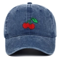 Detailed view of red cherry embroidery on a vintage washed blue cotton denim baseball cap - Adjustable / Navy Blue