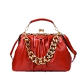 Red ruched leather crossbody bag with gold frame closure and chunky chain detail - Red