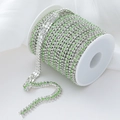 Three-row green crystal rhinestone chain with silver plating on a white spool roll - 1 Yard/Pack / Silver Base White+Light Green
